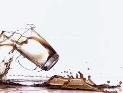 MS SLO MO Cup of coffee falling, spilling and splashing on floor against white background / Vieux Pont, Normandy, France  Stock Footage