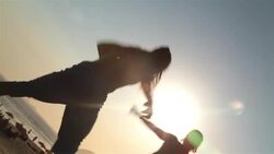 Capoeira fighters spar on Ipanema beach boardwalk Stock Footage