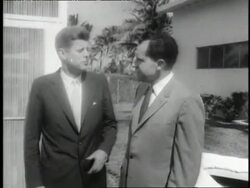 U.S. President John F. Kennedy shakes hands with defeated U.S. presidential candidate Richard Nixon after the election. Stock Footage