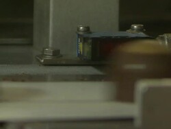Close Up static - Chocolate candies speed along a conveyor belt in the Buckeye Candy factory /  Ohio, United States Stock Footage