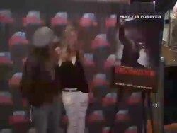 EVENT CAPSULE REPORTER/CHYRON: Rob Zombie & Sheri Moon Zombie Donate Memorabilia at Planet Hollywood, New York, NY, 8/18/09 Stock Footage