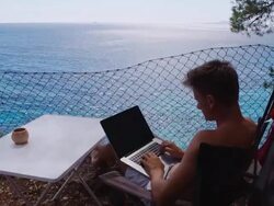 LS DS Man Working On Laptop In The Camp Stock Footage
