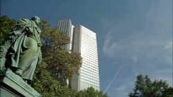 The Eurotower and Commerzban Tower rise behind the statue of Goethe. Stock Footage