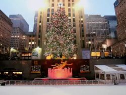 WS Ice skating rink below rockerfeller centre building / New York, United States Stock Footage