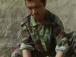 CU TD ZI Afghan soldier washing clothes / Musa Qala, Helmand Province, Afghanistan. Stock Footage