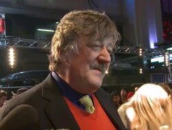 INTERVIEW: Stephen Fry on how cold it was on set, trying to find a cape for the premiere, being a Sherlock Holmes devotee at the Sherlock Holmes: A Game Of Shadows: European Premiere at Empire Leicester Square on December 08, 2011 in London, England  Stock Footage