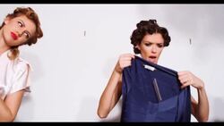 Three women choose what to wear Stock Footage