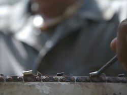 CU TU Chainsaw blades being sharpened by worker / Tawau, Sabah, Malaysia Stock Footage
