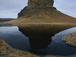 MS TU Shot of mountain reflected in Choppy lagoon under blue sky / Iceland Stock Footage