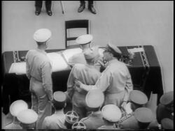 B/W 1945 high angle REAR VIEW Nimitz sits at table / officers in background / surrender of Japan on U.S.S. Missouri Stock Footage