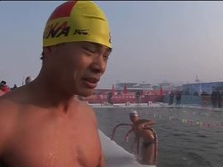 Hundreds brave ice cold waters to race 25 metres News Clip