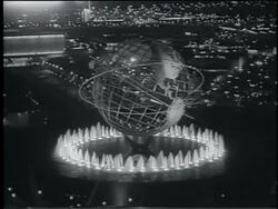 B/W 1964 high angle lit Unisphere surrounded by fountains at night / NY World's Fair Stock Footage
