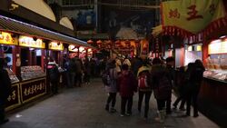 China, Beijing, Food stalls in Wanfujing Dajie Street, Beijing's main shopping street at night Stock Footage