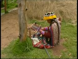 Native South American in traditional clothes weaving cloth, Peru Stock Footage
