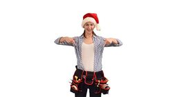 slender young woman construction worker in a cap of Santa Claus shows a copy space on a white background Stock Footage