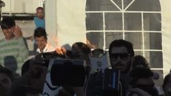 Syrian bears Olympic flame through refugee camp News Clip