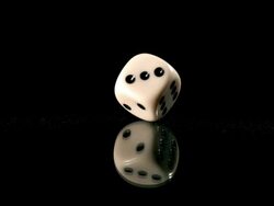 High speed dice rotating on lantern slide Stock Footage