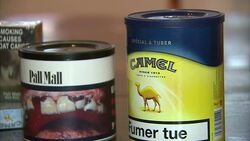 Branded Cigarette Packages With Different Health Warnings On News Clip