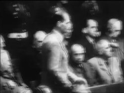 B/W 1946 Rudolf Hess saying plea into microphone at war crimes trial / Nuremberg / newsreel Stock Footage