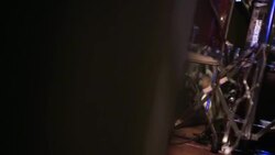 Drummer's feet hammer on the kick drum pedal on stage at rock concert Stock Footage