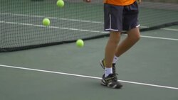 Male tennis player bouncing tennis ball with racket.  - Slow Motion Stock Footage