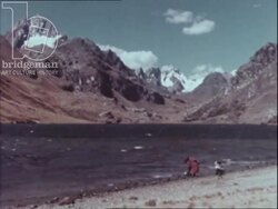 Journey For Survival part three - Mother brings her children to collect water from a lake in the Peruvian mountains. Stock Footage