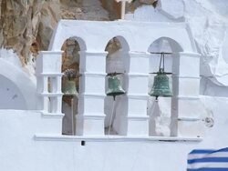 CU TD Shot of man ringing bell in monastery at wall of rock / Amorgos, Cyclades, Greece Stock Footage