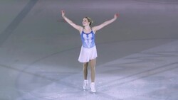 SLO MO Female figure skater elegantly bowing to her audience Stock Footage