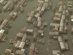 WS AERIAL View of dirty flooded city with loags on water / Lagos, Nigeria Stock Footage