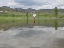 HD video flooded street and sign Colorado Chatfield State Park Stock Footage