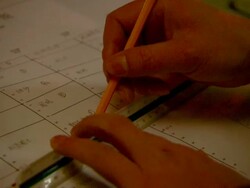 Close Up hand-held zoom-out - A tram operator completes a work sheet./Beijing, China Stock Footage