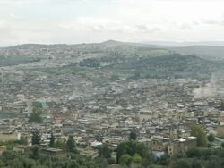WS PAN View of city of Fez with traditional houses and hills and blue sky / Fez, Fes-Boulemane, Morocco Stock Footage