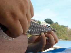 playing ukulele Stock Footage