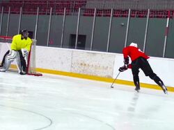 HD Slo-Mo Shot of Ice Hockey Player Skating with the Puck Stock Footage