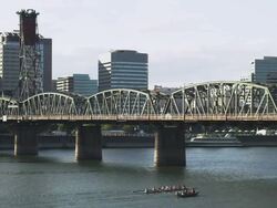 MS Shot of Boats on sunny day in Portland Oregon near Hawthorne bridge with downtown behind them / Portland, Oregon, United States  Stock Footage