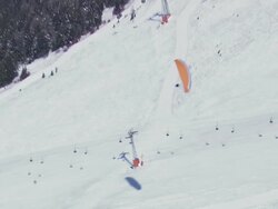 WS AERIAL TS View of Parasailing in snow / Switzerland Stock Footage