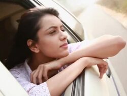 Woman watching from window of a car  Stock Footage