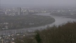 Fog settles over a river that winds through Frankfurt, Germany. Stock Footage