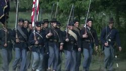Union soldiers march with Union flags during the Civil War. Stock Footage