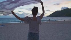 Woman stretching on beach Stock Footage