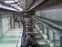 Laboratory danger high voltage sign. Trucking shot of particle accelerator.    Stock Footage