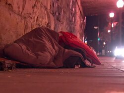 Homeless person sleeping on a winter's night News Clip