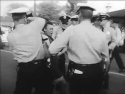 B/W 1963 policemen using force to arrest Black woman at civil rights protest / Alabama / newsreel Stock Footage