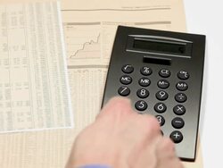 financial clip - using a calculator Stock Footage