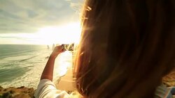 Young woman takes picture of Twelve Apostles using mobile phone Stock Footage