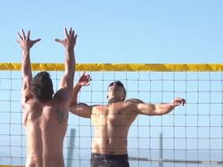 Men playing beach volleyball. - Slow Motion - filmed at 240 fps Stock Footage