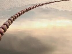 MS Shot of buoys floating in lake with sunset reflection / Orcas Island, Washington, United States Stock Footage