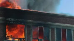 Firefighters gather to participate in the controlled burn of a nearly century-old elementary school building in the western Iowa town of Exira. (June 1) News Clip