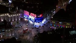 Aerials of Piccadilly Circus at night time News Clip
