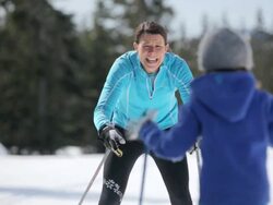 MS PAN Girl skiing with her mom  / Whistler, BC, Canada   Stock Footage
